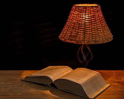 Nighttime reading setup with a warm desk lamp