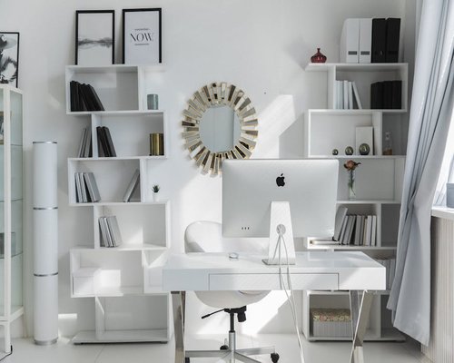 Organized clean home office setup with natural lighting